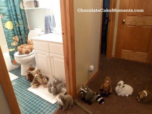 animals-in-line-at-bathroom-with-logo